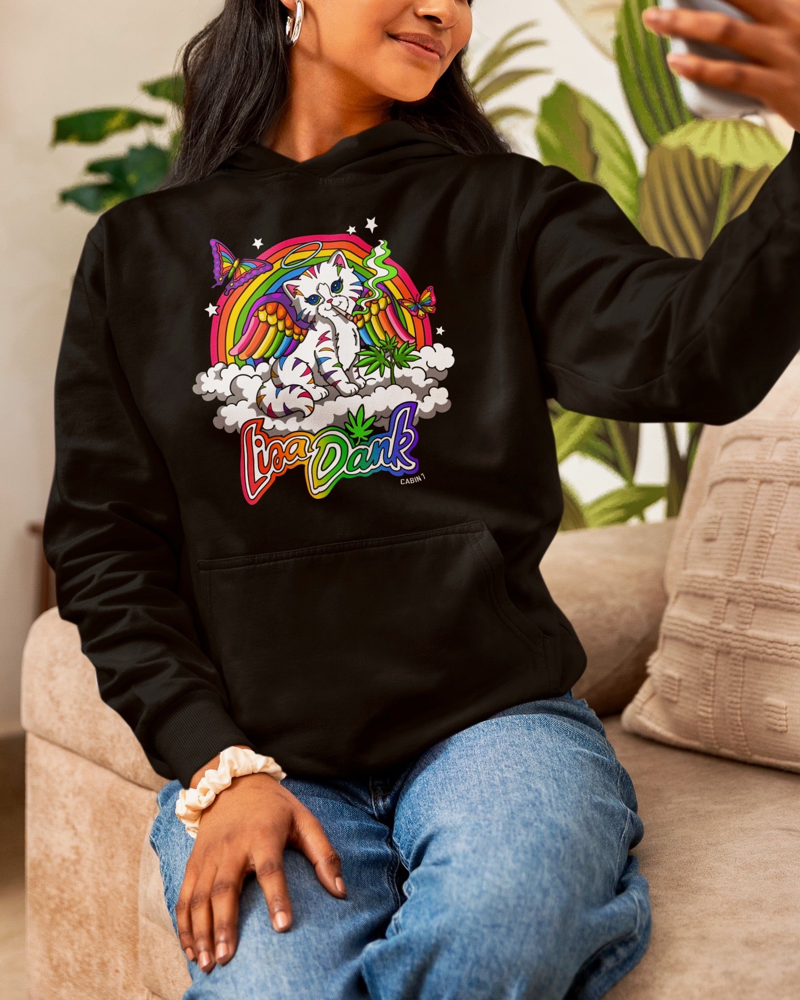A black hoodie with a colorful stoner Lisa Frank style design, featuring a kitten with angel wings, a rainbow, and a weed plant. Text says "Lisa Dank". Hippie hoodie, stoner hoodie, 420 hoodie.