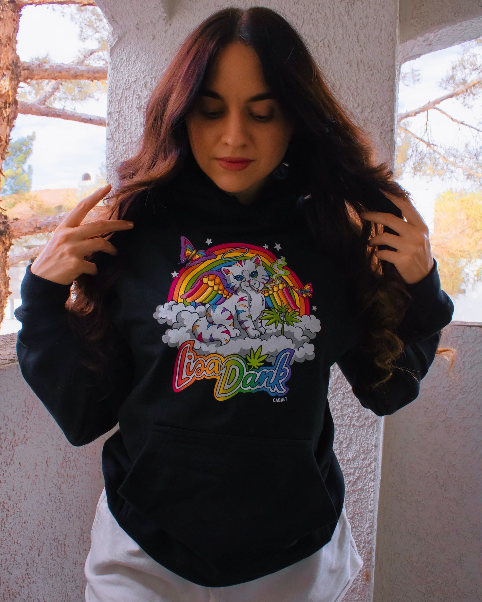 A black hoodie with a colorful stoner Lisa Frank style design, featuring a kitten with angel wings, a rainbow, and a weed plant. Text says "Lisa Dank". Hippie hoodie, stoner hoodie, 420 hoodie.