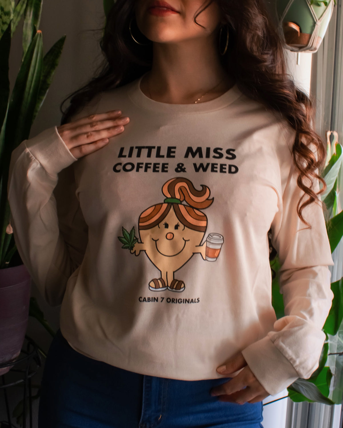 A long sleeve t-shirt with black text reading 'LITTLE MISS COFFEE & WEED' and a Little Miss character holding a coffee cup and cannabis leaf.