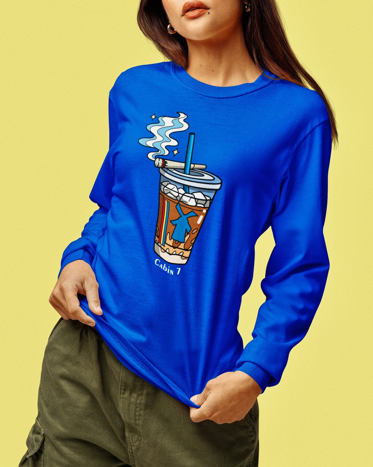 A cobalt blue graphic Dutchie Bros long sleeve shirt with graphic showing a Dutch Bros Coffee cup with smoke and the text 'Cabin 7'.