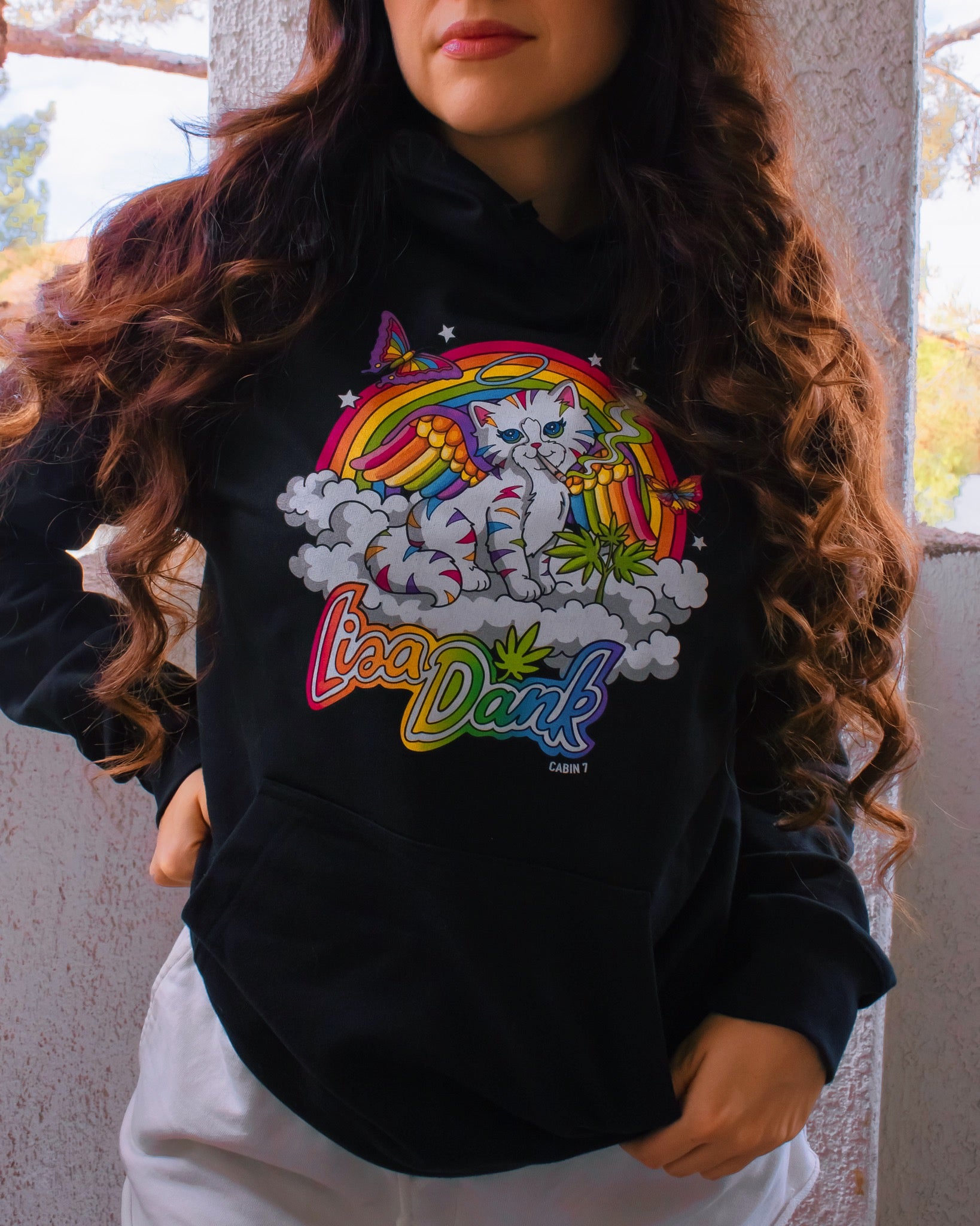 A black hoodie with a colorful stoner Lisa Frank style design, featuring a kitten with angel wings, a rainbow, and a weed plant. Text says "Lisa Dank". Hippie hoodie, stoner hoodie, 420 hoodie.