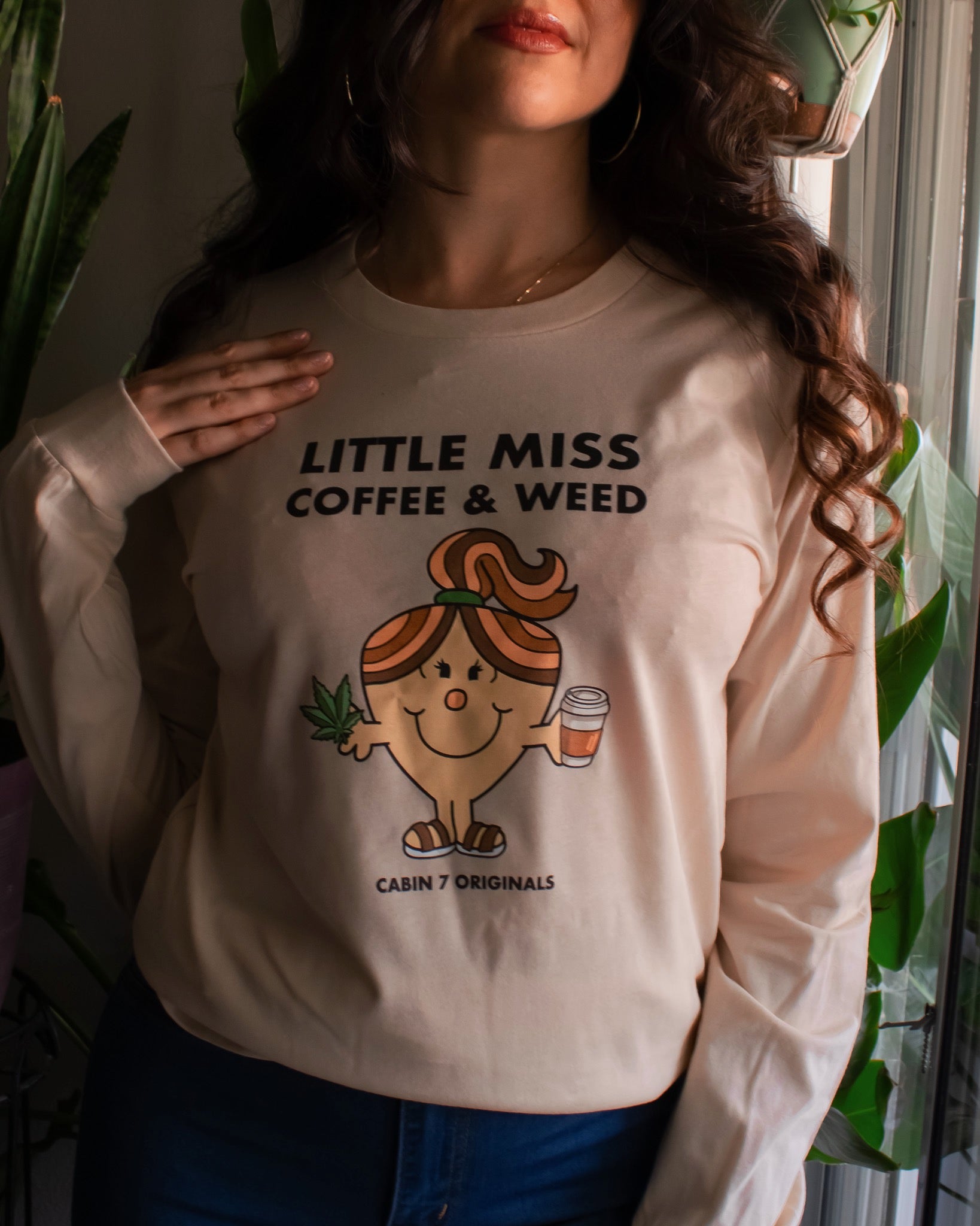 A long sleeve t-shirt with black text reading 'LITTLE MISS COFFEE & WEED' and a Little Miss character holding a coffee cup and cannabis leaf.