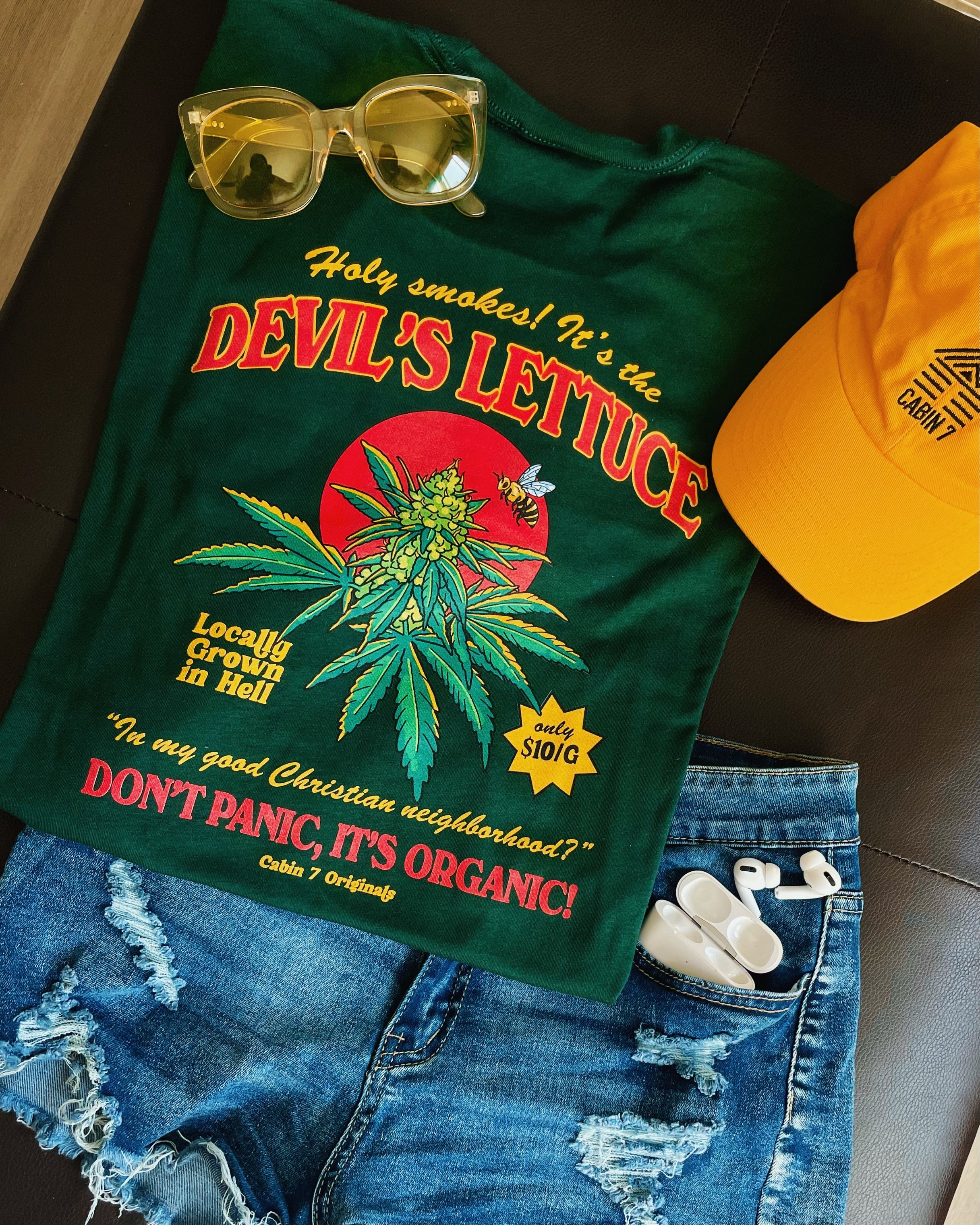 Back of green Cabin 7 cotton t-shirt with 'Devil's Lettuce, Don’t Panic, It’s Organic’ graphic. 