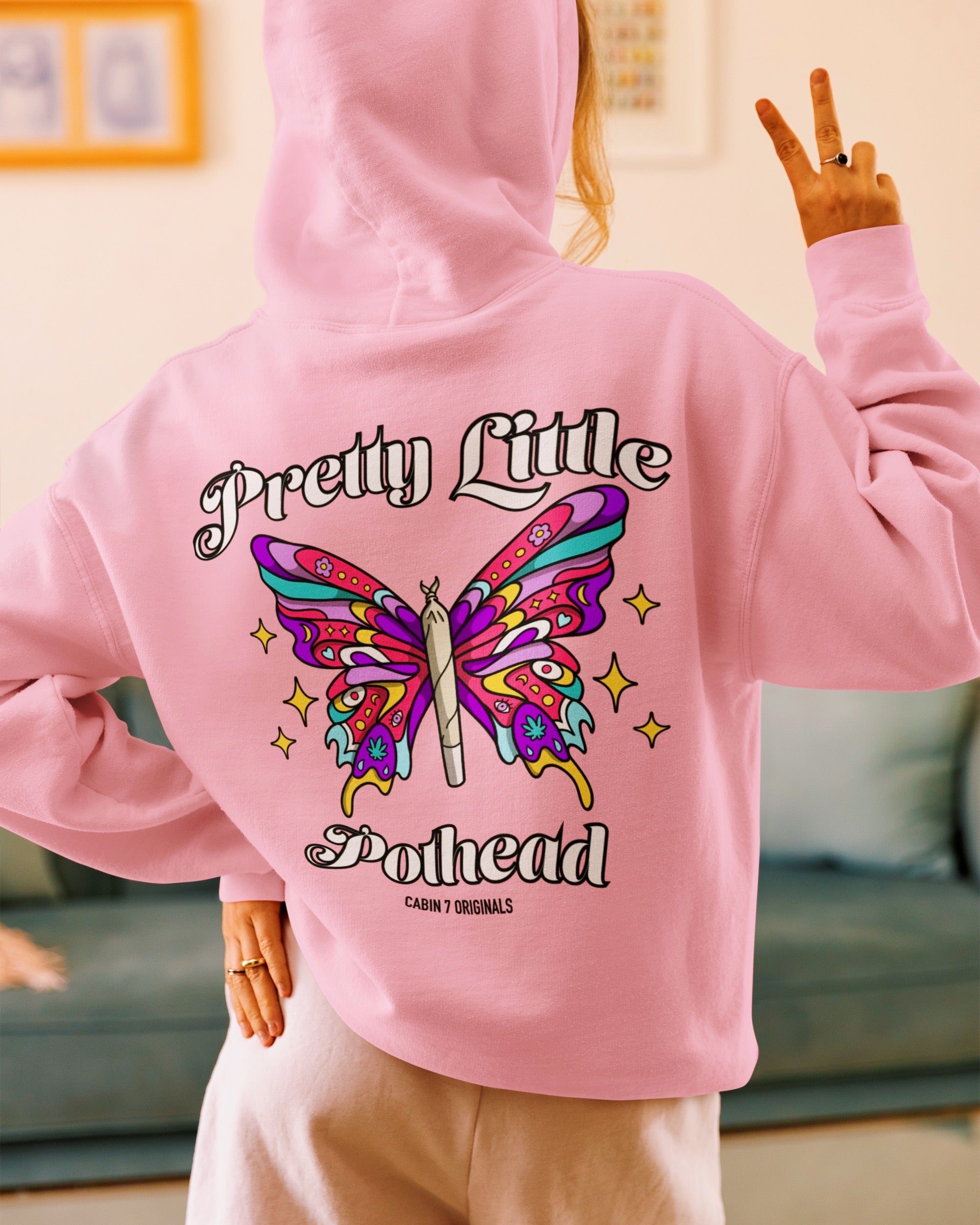 A baby pink hoodie with text "Pretty Little Pothead" and a colorful butterfly with a rolled joint as the body. Hippie girl apparel, stoner girl hoodie, 420 hoodie.